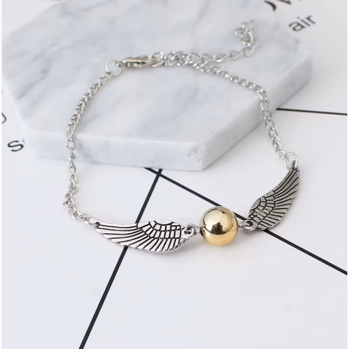 Ασημένιο αξεσουάρ με σύμβολα Harry Potter